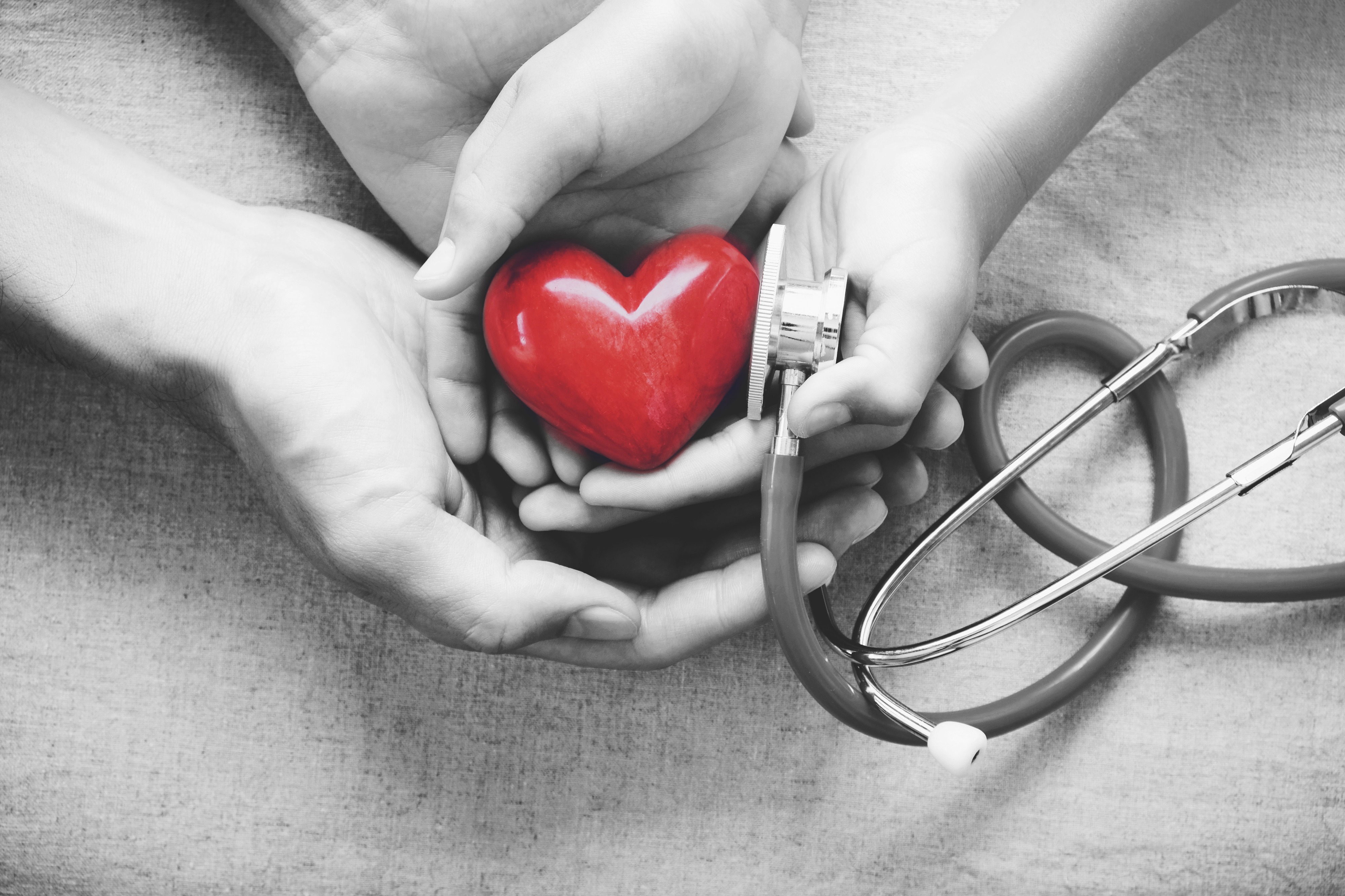 hands-holding-heart-with-stethoscope